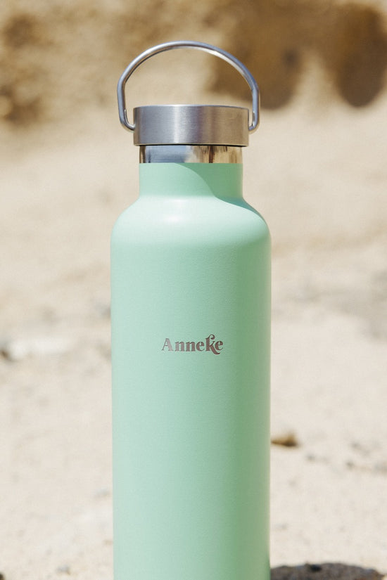 A sea green stainless steel Agüita insulated bottle customised with a name